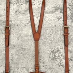 This cognac suspender with its splendid color that can match with any cognac color shoes. Our cognac genuine leather suspender is made with premium brass hardware. It is equipped three sturdy brass hardware clips that will hold your pants tightly so you don't be concern about it will loose easily. This suspender is designed for groomsman, groom, best man, father, and graduating student on the special day right here on theirs life. It will make them fell comfortable and look like much more gentle Classic Formal Adjustable Belts And Suspenders, Elegant Brown Belts And Suspenders For Formal Occasions, Adjustable Brown Leather Belts And Suspenders, Classic Formal Belts And Suspenders With Adjustable Strap, Adjustable Vintage Belts For Formal Occasions, Elegant Formal Belts And Suspenders With Leather Strap, Classic Brown Belts And Suspenders For Wedding, Elegant Brown Belts And Suspenders For Wedding, Classic Leather Belts And Suspenders With Adjustable Fit