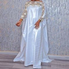 Plus Size White Boubou Ankara Dashiki Lange Kaftan RobeMaterial: COTTONMaterial: PolyesterType: DashikiGender: WOMENItem Type: Africa ClothingSpecial Use: Traditional Clothing Elegant White Long Sleeve Agbada, White Floor-length Abaya, White Embroidered Kaftan For Party, White Floor-length Kaftan For Party, White Floor-length Abaya For Eid, White Bohemian Style Floor-length Abaya, White Bohemian Floor-length Abaya, Traditional White Long Agbada, Traditional White Maxi Length Abaya