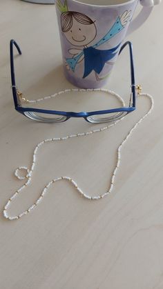 "You can always wear it easily. You can use it not only as eyeglass chain, but also as a necklace and bracelet with white color. Measures approx. 30\" (75 cm) total length Sunglasses necklace will be a perfect gift for yourself and your loved ones. The price is for 1 piece of eyeglass . I can make it in any color you want. Please contact me. Thank you for visiting my store." Trendy White Beaded Necklaces With Adjustable Chain, Trendy White Beaded Necklace With Adjustable Chain, Elegant Handmade Glasses Chain For Everyday, White Adjustable Glasses Chains For Fashion, White Beaded Necklace With Adjustable Chain As Gift, Trendy White Glasses Chains With Colorful Beads, Trendy White Beaded Glasses Chain, Trendy White Glasses Chains, Adjustable White Glasses Chains With Colorful Beads