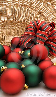 red and green christmas ornaments in a basket