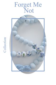 the front cover of forget me not, with blue beads and flowers on it in a circle