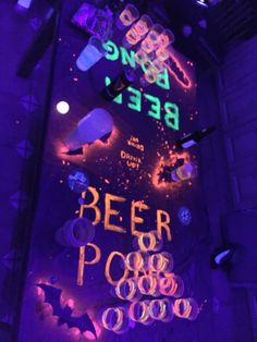 a neon sign that says beer poop on it