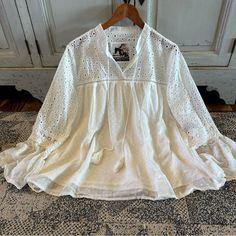 We Are Obsessed With This Boho Vintage Style Boutique Labeled Blouse. This Pretty Blouse Features A Soft White Chiffon Base, V-Neck Eyelet Cut Out Lace Details And Feminine Fit. + Well Made + True To Size + Model Is 5'8" / 140 Lbs And Modeling A Size Medium + Polyester / Imported Approx. Measurements: Small: Pit To Pit: 19", Length: 23" Medium: Pit To Pit: 20", Length: 23" Large: Pit To Pit: 21", Length: 24" Xl: Pit To Pit: 22", Length: 25" ** Double Pit To Pit For Total Bust Brand New With Tags White Lace Patchwork Blouse, Feminine White V-neck Blouse, White V-neck Blouse With Lace Top, Bohemian White V-neck Blouse, Spring Day Out Blouse With Lace Patchwork, Spring Brunch Blouse With Lace Patchwork, Spring Blouse With Lace Patchwork For Brunch, Lace Patchwork Blouse For Day Out In Spring, Lace Patchwork Blouse For Spring Day Out