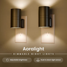 two lights on the wall with dimmers in front of them and an advertise light below