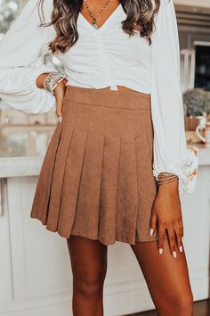 Our 'Spill It" pleated skort will have you looking on-trend this season! Features corduroy skirt in a mocha hue, side zipper, and built in shorts.           Measurements S :  Hip 36", Inseam 2.5", Length 16.5", Waist 26".  M :  Hip 38", Inseam 2.5", Length 17", Waist 28".  L :  Hip 40", Inseam 3", Length 17.5", Waist 30". Corduroy Skirt, Mocha, Side Zipper, That Look, Built In, Mini Skirts, Luxury Fashion, Zipper, Skirt