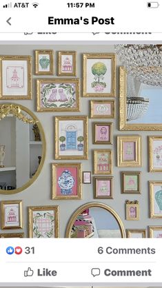 a wall covered in lots of framed pictures next to a mirror and chandelier