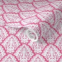 a pink and white wallpaper with an intricate design on it's surface,