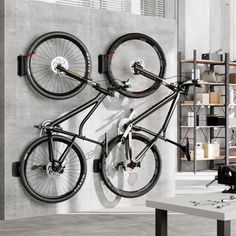 there is a bike hanging on the wall