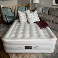 an inflatable bed with two pillows on it