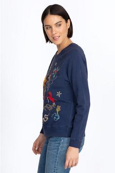 Adopting a casual everyday silhouette, the Texas Raglan Sweatshirt brings a touch of playfulness to your off-duty repertoire. Cut in a regular fit, this sweatshirt is fabricated from pure cotton and boasts a crew neck, long raglan sleeves, and a lively placement embroidery complete with a range of motifs inspired by Texas. Team this sweatshirt with jeans or pair with shorts for a stylish yet laid-back post-beach ensemble. Johnny Was Women's Texas Raglan Sweatshirt in Navy Blue, Size Small, Cotto French Terry Crew Top With Graphic Print, Graphic Print French Terry Crew Top, Graphic Print Crew Top In French Terry, Blue French Terry Crew Top, Graphic Print Crew Neck Top In French Terry, French Terry Tops With Graphic Print For Loungewear, Graphic Print French Terry Tops For Loungewear, Casual French Terry Tops With Graphic Print, Blue French Terry Long Sleeve Tops