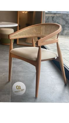 a chair sitting on top of a cement floor next to a window