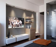 a room that has a refrigerator and some shelves on the wall in front of it