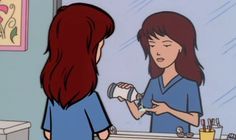 a woman with red hair is talking to another woman in front of a bathroom mirror