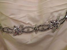 a bridal belt is adorned with crystal stones