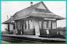 an old black and white photo of a train station