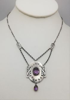 "A beautiful example of the Arts and Crafts necklaces c1900 created by Murrle Bennett, the Anglo German company, who mainly sold through Liberty & Co of London. This is a beautiful example, as it ticks so many boxes. In original condition, tick- stones both perfect, tick - original chains, tick - original toggle fastener, tick - gold mounts to the two amethysts, tick - fully signed as  Murrle Bennett piece with clear MBo and 950 stamps, tick and finally, in excellent condition, tick! A lovely ne Art Nouveau Jewelry With Historical Design For Formal Events, Antique Silver Necklace With Historical Design, Art Nouveau Jewelry With Historical Design For Formal Occasions, Vintage Hand Forged Jewelry For Formal Occasions, Antique Hand Forged Jewelry For Formal Occasions, Antique Amethyst Jewelry For Formal Occasions, Antique Purple Sterling Silver Jewelry, Antique Sterling Silver Purple Jewelry, Antique Hand-forged Jewelry For Formal Occasions