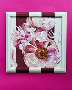 a painting on a pink wall with white and red flowers