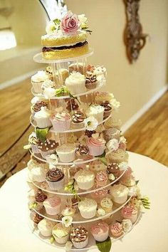 a tiered cupcake display on top of a table