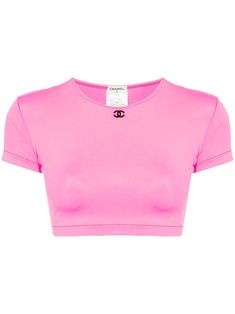 circa 1995 pink signature interlocking CC logo crew neck short sleeves cropped straight hem Condition: GOOD. This previously owned and used item is in good condition with minimal signs of use. This may include fading of material or plating and scratches. Purchasing this item continues its narrative and reduces the environmental impact by avoiding the use of new resources needed to make the product from scratch, such as water, materials and electricity, and avoiding additional manufacturing impac Pink Y2k Cropped T-shirt For Streetwear, Pink Y2k Cropped Crew Neck T-shirt, Chanel Crop Top, Farfetch Crop Top, Luxury Pink Crew Neck T-shirt, Tumblr Fashion, Shopping Chanel, City Dress, Summer Beach Wear