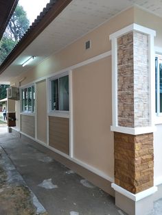 the front of a house with windows and siding