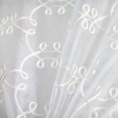 closeup of white fabric with intricate design