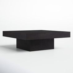 a black table sitting on top of a white floor