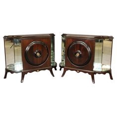 pair of art deco nightstands with mirrored doors and brass accents, circa 1950's