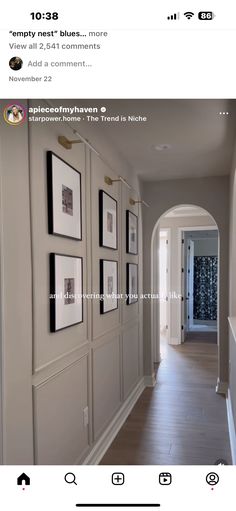 an image of a hallway with pictures on the wall