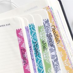 an open planner book with colorful writing on it