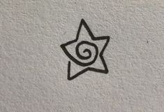 a black and white drawing of a star with a spiral in it's center