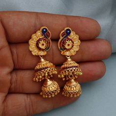 Discover the allure of Handmade Gold Jewelry at https://morvijewels.etsy.com/   Get a dazzling 25% off on all our 22k and 18k gold pieces. Don't miss out on this limited-time offer. Shop now and embrace the radiance of gold! Beautiful 22 Karat Gold Handmade Earrings jhumki Traditional Design jewelry Gold Purity- 22k yellow Gold Length - 5 cm Width - 1.8 cm max Weight - 14.44 grams approx The earrings comes with normal push/backs If you want real gold push please let us know. Thank You Click to s Temple Jewelry Tilla Jhumkas, Gold Bollywood Jhumkas With Peacock Design, Temple Style Dangle Jhumkas, Wedding Navratri Danglers With Intricate Design, Wedding Danglers For Navratri With Intricate Design, Wedding Danglers With Intricate Design For Navratri, Traditional Danglers For Wedding And Navratri, Gold Kundan Earrings For Marriage, Temple Jewelry Style Jhumkas For Wedding With Cutdana