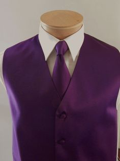 Silk Feel Microfiber Satin Full Back And Adjustable Vest set. The Vest Is Fully Lined With Matching Material Covered Buttons. It Comes With Two Outside Lined Pockets A Regular Four In Hand Tie Measurements Are 58 Inches Long And 3 1/4 Inch Wide With The Matching Fabric Pocket Square. Mens Formal Vest, Formal Vest, Purple Vests, Mens Vests, Mens Formal, Vest Outfits, Tie And Pocket Square, Mens Vest, Back To Black