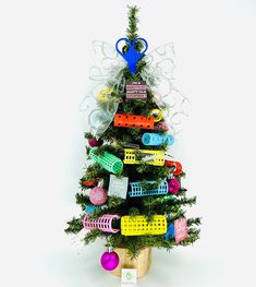 a small christmas tree with lots of colorful items on it