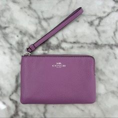 Brand new with the tag Authentic Color is SV/violet orchid, a lilac purple Refined pebble leather Silver hardware Two credit card slots Zip-top closure, fabric lining Wrist strap attached 6 1/4" (L) x 4" (H) x 1/2" (W) Same or next day shipping! Purple Wallet With Zipper For Everyday Use, Purple Wallet With Card Slots For Everyday Use, Luxury Purple Wallet, Luxury Purple Rectangular Wallet, Purple Rectangular Wallet With Zipper Closure, Wristlet Wallet, Vintage Branding, Lilac Purple, Leather Silver