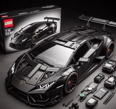 a lego model of a black sports car next to it's box and accessories