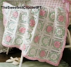 a crocheted blanket sitting on top of a chair