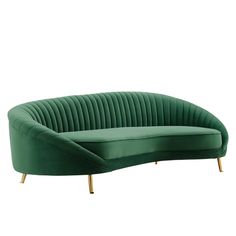 a green velvet sofa with gold legs