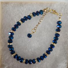 Blue Color Glass Crystal Faceted Bracelet ,Blue Beads, Blue Faceted Beads, Faceted Round Beads, Gold Rhinestone Spacers, Gold Clasp Approximately 7 inches, make sure this will fit your wrist. Beads used are  6 mm in diameter  All my bracelets are handmade by me. Please note -  I do my very best to give you accurate measurements and descriptions All my jewelry is delivered in a gift box and beautiful organza gift bag, perfect for keeping your jewelry safe, or ready to give if it is a gift! Colors could vary due to lighting * see more brackets at https://decowrist.etsy.com/ No refunds or exchanges Cheap Blue Crystal Round Bracelet, Blue Crystal Bracelet With Polished Beads For Gift, Blue Crystal Bracelet With Polished Beads As Gift, Blue Crystal Bracelet With Polished Round Beads, Blue Crystal Beaded Bracelets With Faceted Beads, Blue Crystal Beaded Bracelets For Jewelry Making, Blue Crystal Bracelet With Spacer Beads, Blue Crystal Bracelet With Round Beads, Elegant Blue Crystal Bracelet With Polished Beads