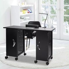 a black computer desk sitting on top of a white rug