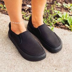 Black Flat Heel Slip-ons For Everyday, Comfortable Black Slip-ons For Everyday, Casual Slip-ons With Rubber Sole Medium Width, Casual Slip-ons With Medium Width Rubber Sole, Comfortable Black Slip-ons With Flat Bottom, Black Slip-ons For Spring, Black Slip-ons For Everyday Spring Wear, Casual Solid Color Slip-ons, Black Slip-ons With Textured Sole For Everyday