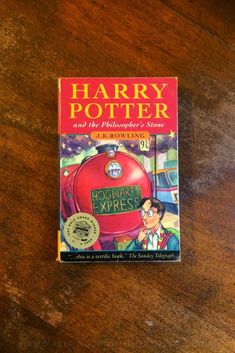 harry potter and the prisoner's stone by j k rowley on a wooden table