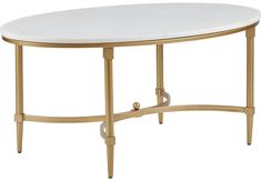 a white table with gold trimmings and a marble top on an oval base