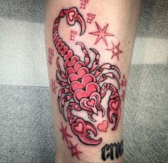 a tattoo on the leg of a woman with red ink and stars around her legs