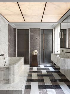 an elegant bathroom with marble walls and flooring