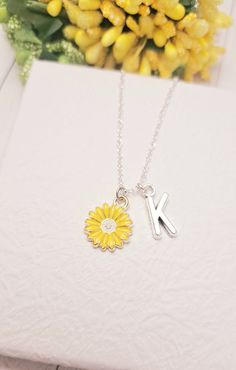 It's more than charm, it's a Sunflower necklace This Cute Sunflower chain necklace comes with a Gold Sunflower charm and a choice of sterling silver chain or gold chain. You can get these personalized necklaces in any length, so please contact me via Etsy Conversations if you need any size. This minimalist and dainty celestial necklace is made with a high-quality material that is eco-friendly, durable, and anti-inflammatory. It won't leave your skin green due to marks. Moreover, the weight of the necklace is quite appropriate, and they come with a Lobster Clasp to provide you a full-day comfort without any hassle. This adult necklace makes the perfect gift for your loved ones on special occasions like anniversaries, bridal showers, engagements, and graduation parties. Mother's Day Jewelry With Flower Charm Initial Pendant, Adjustable Flower Charm Pendant Necklace, Sterling Silver Charm Necklace With Flower For Mother's Day, Personalized Sterling Silver Flower Pendant Charm Necklace, Sterling Silver Birth Flower Initial Pendant Charm Necklace, Sterling Silver Birth Flower Initial Charm Necklace, Mother's Day Sterling Silver Necklace With Flower Charm, Dainty Necklace With Initial Pendant And Flower Charm, Mother's Day Flower Charm Necklace With Initial Pendant