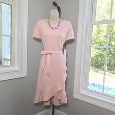 Brand : Calvin Klein Size : 12 Type Of Dress : Faux Wrap Dress (Attached) Neckline : Bateau Color : Pink Print : Solid Features : Ruffle, Bow, Belt, Lined Condition : New With Tags Laying Flat Armpit To Armpit : 19.5” Across Laying Flat Waist : 16” Across Laying Flat Hips : 19.5” Across Length From Shoulder To Bottom Hem : 41” Brand New With Tags! Beautiful Feminine Dress! Excellent Condition And Quality. Smoke Free Home And Happy To Combine Shipping On Additional Items Prior To Making Purchase. Fitted Pink Midi Dress With Tie Waist, Pink Fitted Midi Dress With Tie Waist, Fitted Calvin Klein Midi Dress For Spring, Spring Calvin Klein Fitted Midi Dress, Calvin Klein Fitted Midi Dress For Spring, Calvin Klein Spring Midi Dress For Work, Calvin Klein Spring Workwear Midi Dress, Feminine Fitted Calvin Klein Midi Dress, Feminine Calvin Klein Knee-length Midi Dress