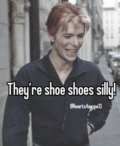 a man with red hair smiles while standing in front of a building and the words they're shoe shoes silly