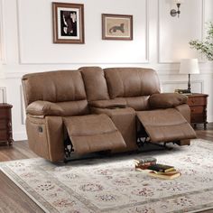 the reclining loveseat has two seats and a cup holder on top of it