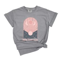 Looking for a cute versatile top to wear this summer? Make sure to grab one of our Shine Your Light Vintage garment dyed graphic tees! This soft and comfortable graphic tee is the perfect top for any outfit. It can be paired with biker shorts, jeans, or even a simple skirt/dress! This tee is true-to-size, so be sure to order your regular t-shirt size! If you are looking for a more oversized look, make sure to size up! Faded Summer Top With Screen Print, Summer Faded T-shirt With Screen Print, Acid Wash Graphic Print T-shirt For Summer, Acid Wash Graphic T-shirt For Summer, Summer Acid Wash T-shirt With Graphic Print, Acid Wash T-shirt With Graphic Print For Summer, Faded Spring T-shirt With Screen Print, Spring Faded T-shirt With Screen Print, Faded Screen Print T-shirt For Spring