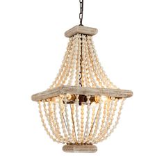 a wooden chandelier with pearls hanging from it's sides and two lights on each side